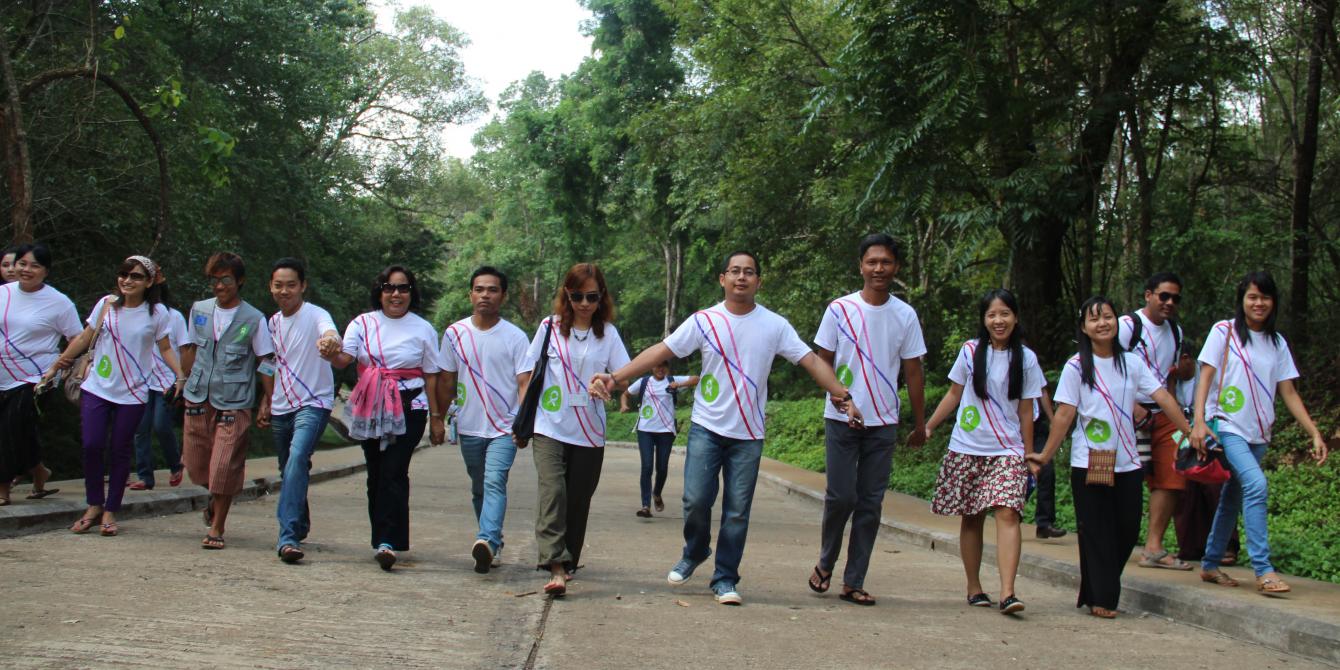 Oxfam in Myanmar Staff, Photo by: Yee Mon Oo/ Oxfam Oxfam in Myanmar staff are holding hands in hands together, working towards the world without poverty and injustice. Photo by: Yee Mon Oo/ Oxfam